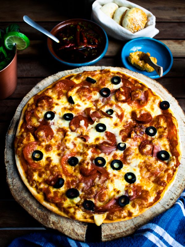 Mozzarella Pizza With Bacon & Olive Toppings